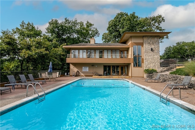 view of swimming pool with a patio