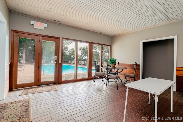 sunroom with french doors and wood ceiling