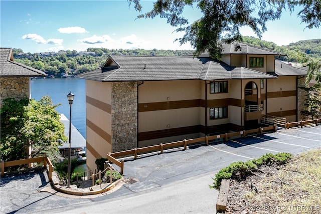 view of building exterior with a water view