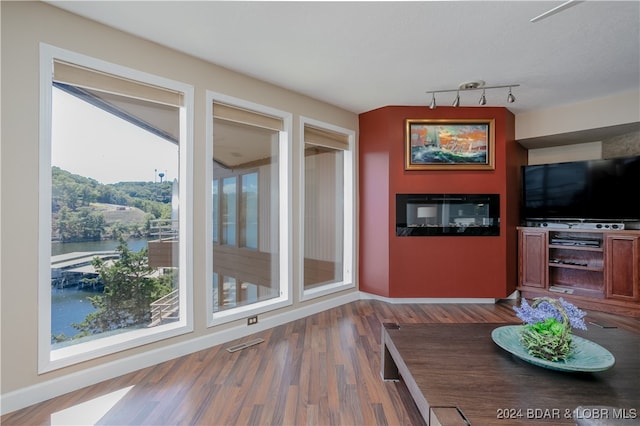 dining room featuring hardwood / wood-style floors and a water view