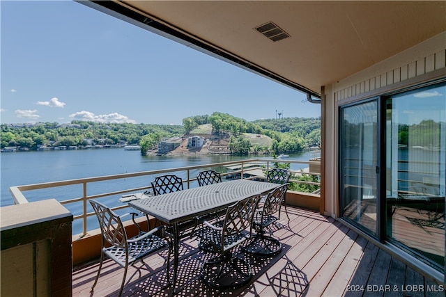 balcony featuring a water view