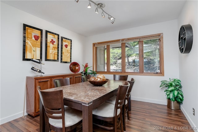 dining space featuring dark hardwood / wood-style flooring