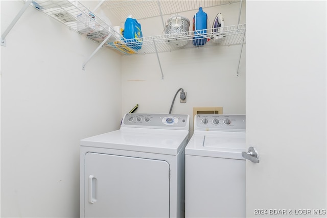 laundry room featuring washing machine and clothes dryer