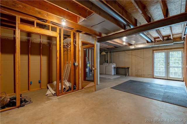 basement with french doors and washing machine and dryer