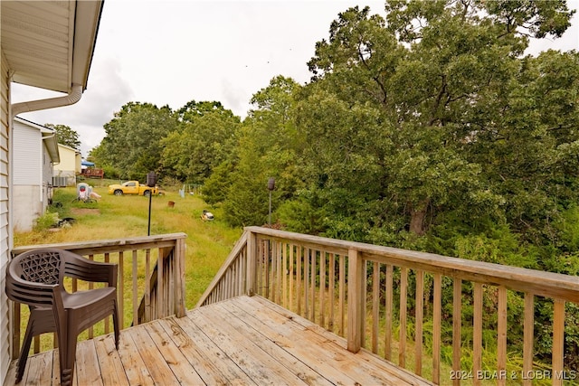 wooden deck with a yard