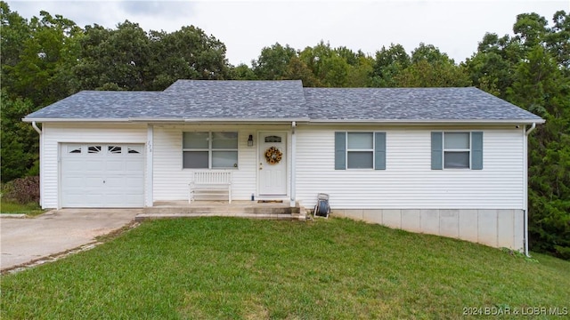 view of front of home with a porch, a garage, and a front lawn