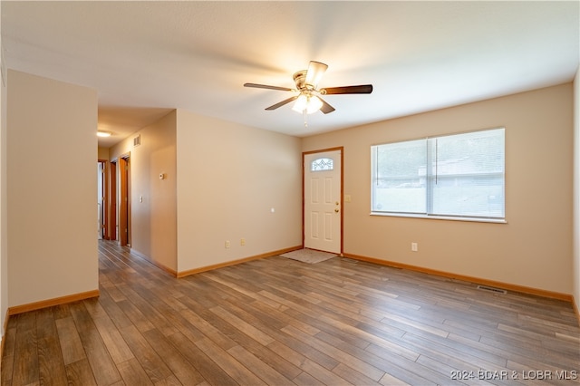 empty room featuring ceiling fan and wood-type flooring