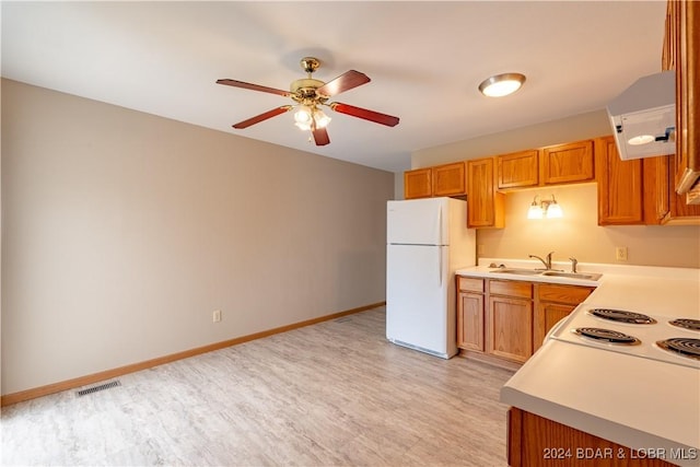 kitchen with white appliances, sink, light hardwood / wood-style flooring, ceiling fan, and extractor fan