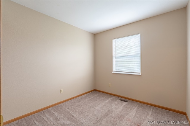 spare room with carpet floors