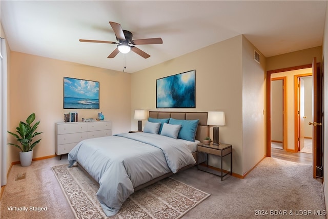 carpeted bedroom with ceiling fan