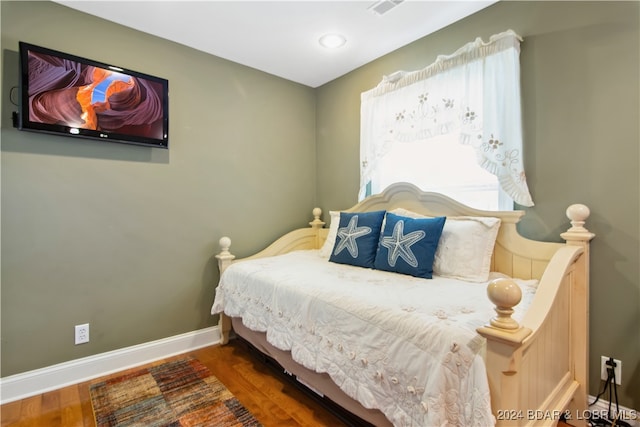 bedroom featuring dark hardwood / wood-style floors