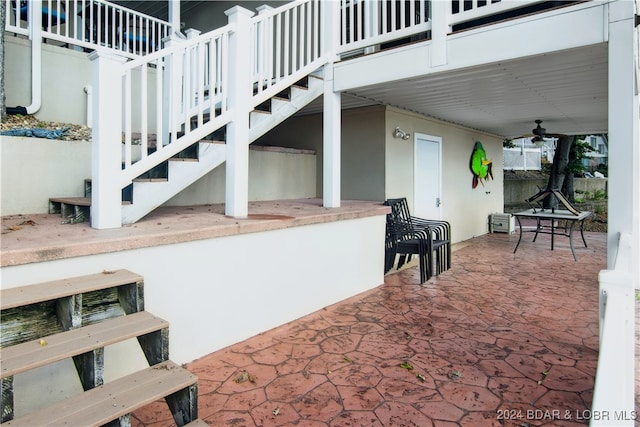 view of patio featuring ceiling fan