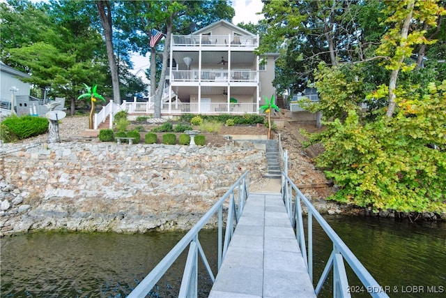 back of house with a water view