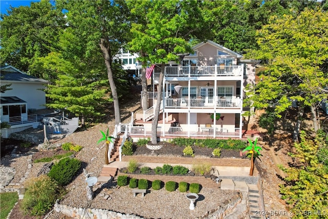 back of house with a balcony