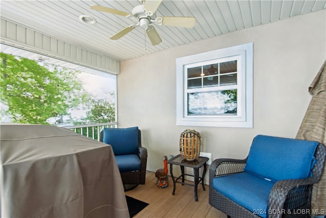 exterior space with hardwood / wood-style floors and ceiling fan