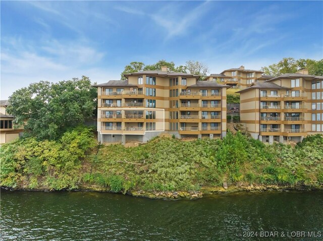 701 Cedar Rd Unit 1B, Lake Ozark, MO 65049 - view of building exterior with a water view