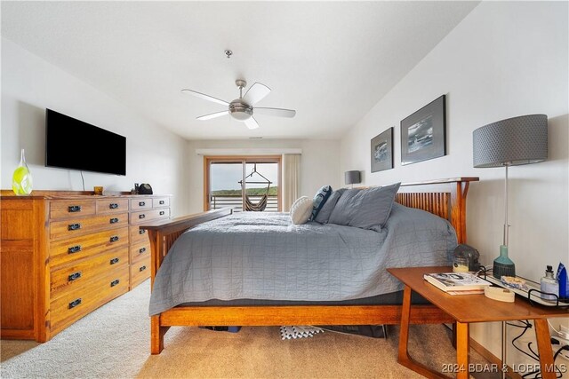 701 Cedar Rd Unit 1B, Lake Ozark, MO 65049 - bedroom with access to outside, a ceiling fan, and light colored carpet