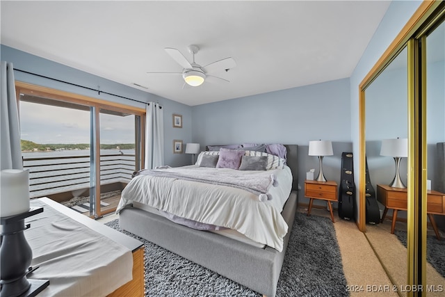 bedroom with ceiling fan, access to exterior, and carpet floors