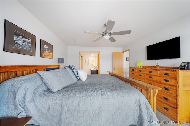 carpeted bedroom with ceiling fan and ensuite bathroom