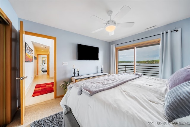 bedroom featuring ceiling fan, access to exterior, and carpet floors