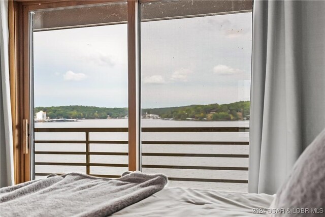 701 Cedar Rd Unit 1B, Lake Ozark, MO 65049 - bedroom with a water view