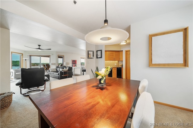 dining area with carpet and ceiling fan