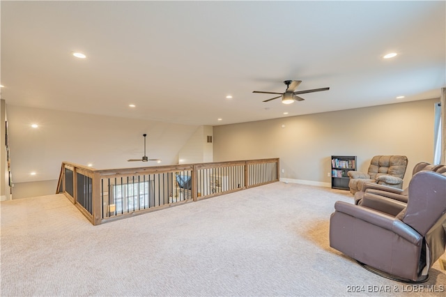 carpeted living room featuring ceiling fan