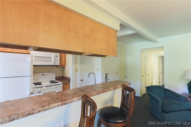 kitchen with white appliances, sink, and tasteful backsplash