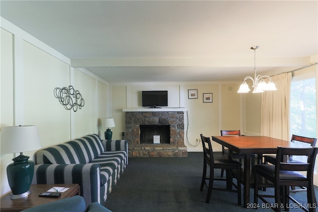 dining area with a notable chandelier, carpet, beamed ceiling, and a fireplace