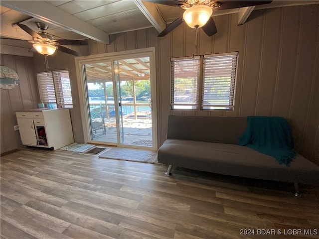 1735 Lick Creek Rd, Edwards, MO 65326 - entryway featuring ceiling fan, beamed ceiling, wood finished floors, and wood walls
