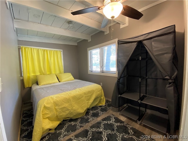 bedroom with ceiling fan, beamed ceiling, wood ceiling, and wood-type flooring