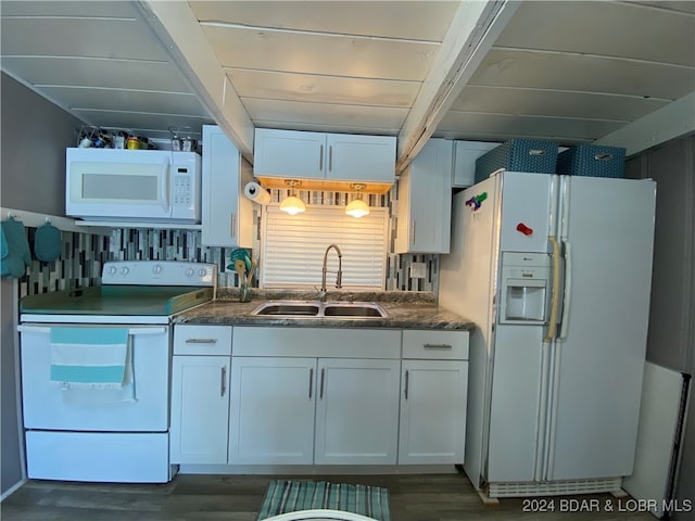 kitchen featuring white appliances, sink, dark hardwood / wood-style flooring, and white cabinets