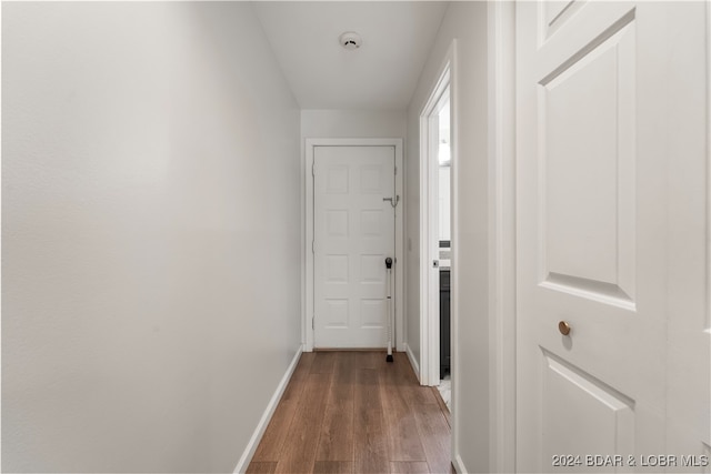 corridor featuring wood-type flooring