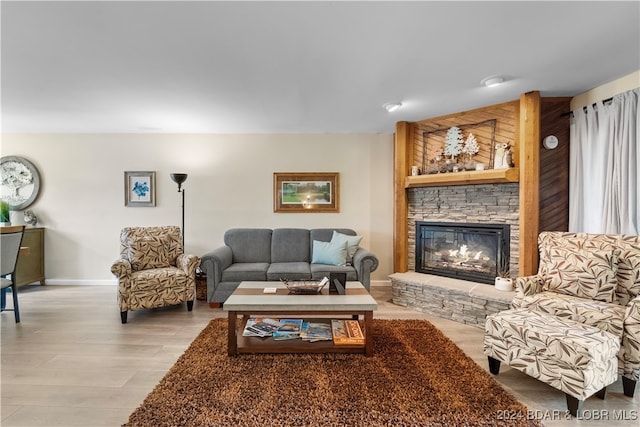 living room featuring a fireplace and light hardwood / wood-style flooring