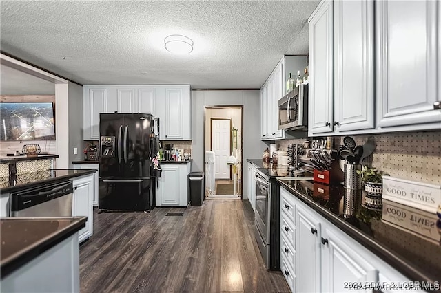 kitchen with white cabinetry, a textured ceiling, appliances with stainless steel finishes, and dark hardwood / wood-style flooring