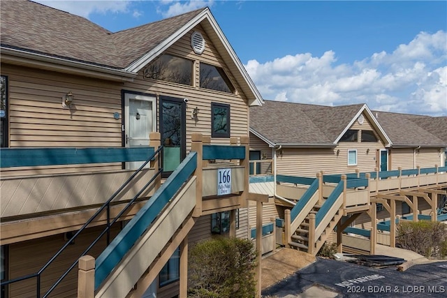 166 Falls Point Dr Unit 2B, Lake Ozark, MO 65049 - view of play area featuring stairway
