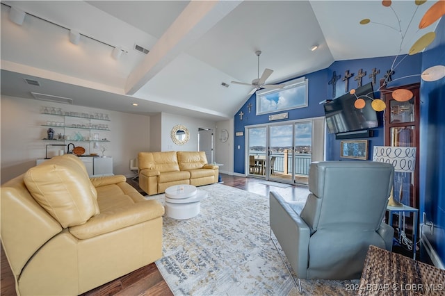 living room with rail lighting, lofted ceiling, ceiling fan, and hardwood / wood-style flooring