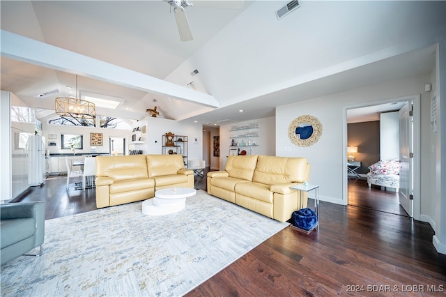 living room featuring ceiling fan with notable chandelier, vaulted ceiling, and dark hardwood / wood-style flooring