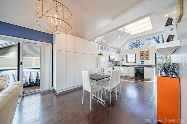 dining space with an inviting chandelier, sink, lofted ceiling with beams, and dark wood-type flooring