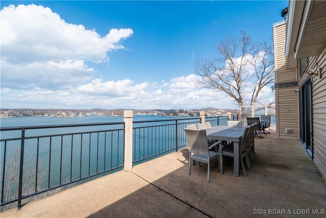 view of patio with a water view