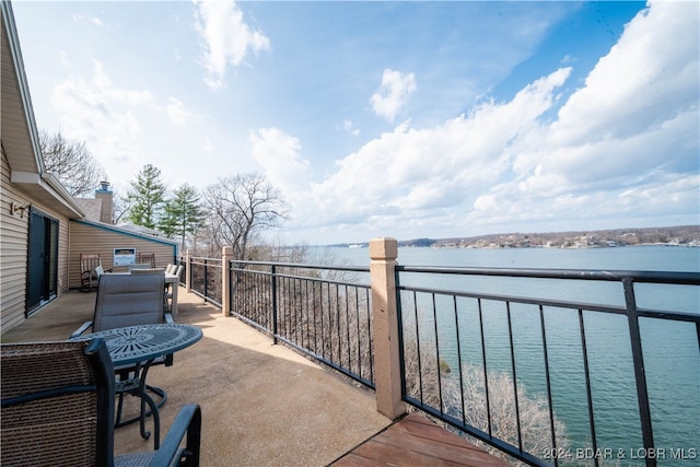 balcony featuring a water view