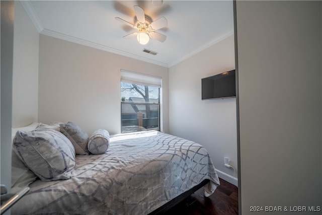 bedroom with ceiling fan, crown molding, and wood-type flooring