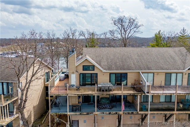 rear view of house with a balcony