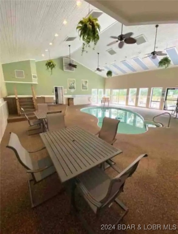 view of pool with a hot tub and ceiling fan