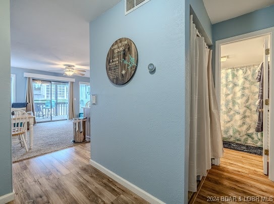 hallway featuring hardwood / wood-style floors