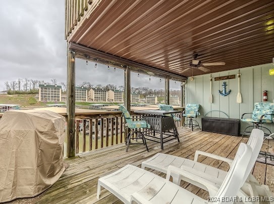 wooden deck featuring ceiling fan