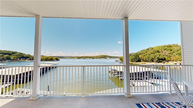 view of patio with a water view