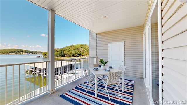 balcony featuring a water view