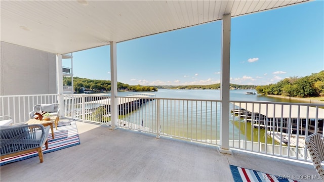 balcony featuring a water view