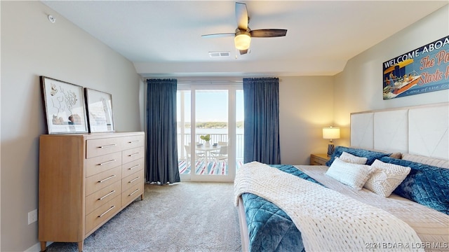 bedroom featuring ceiling fan, light colored carpet, and access to exterior